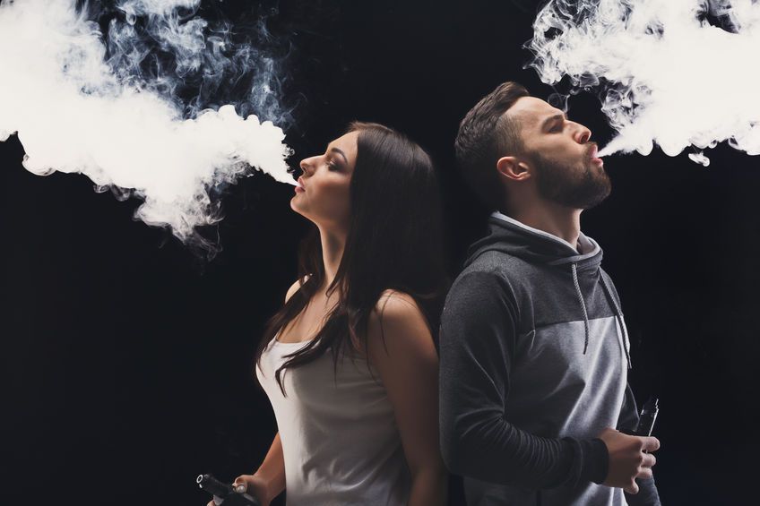 men and women vaping